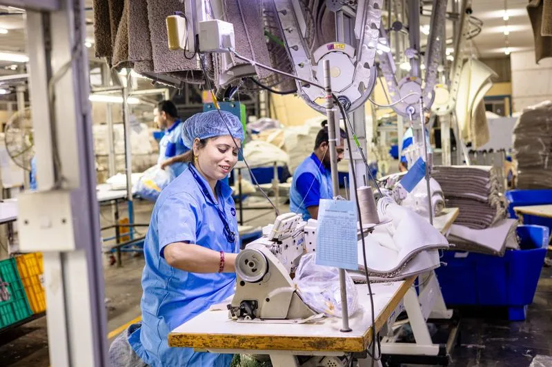 Factory worker checking products